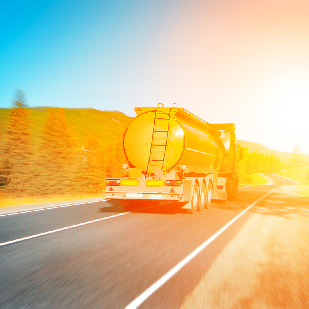 Fuel truck on highway with blue sky in background